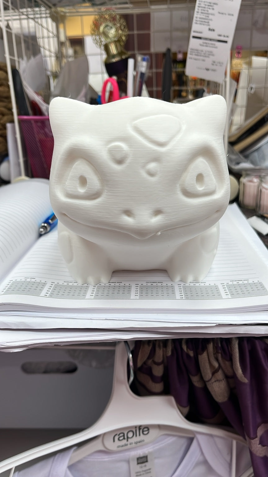 White 3D printed bulb creature figure, front view