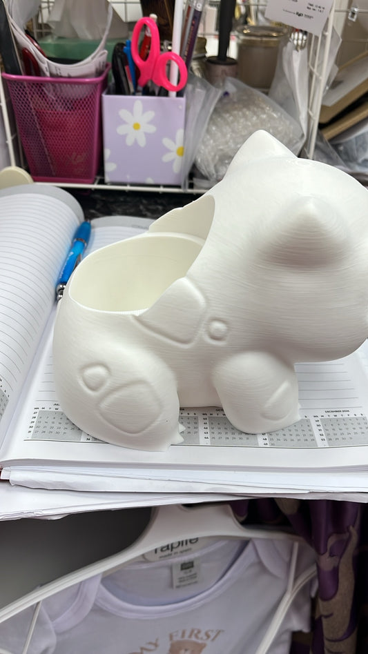 White 3D printed bulb creature figure showing hollow back compartment