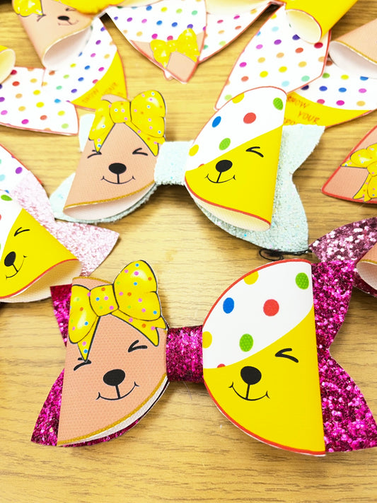 Pudsey and Blush Children in Need glitter hair bow close-up